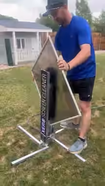Screen cleaning in action, from the Pane Pros Window Cleaning website