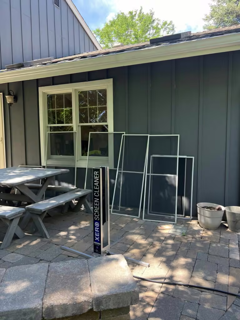 Window screen cleaning at a residential property by Pane Pros Window Cleaning