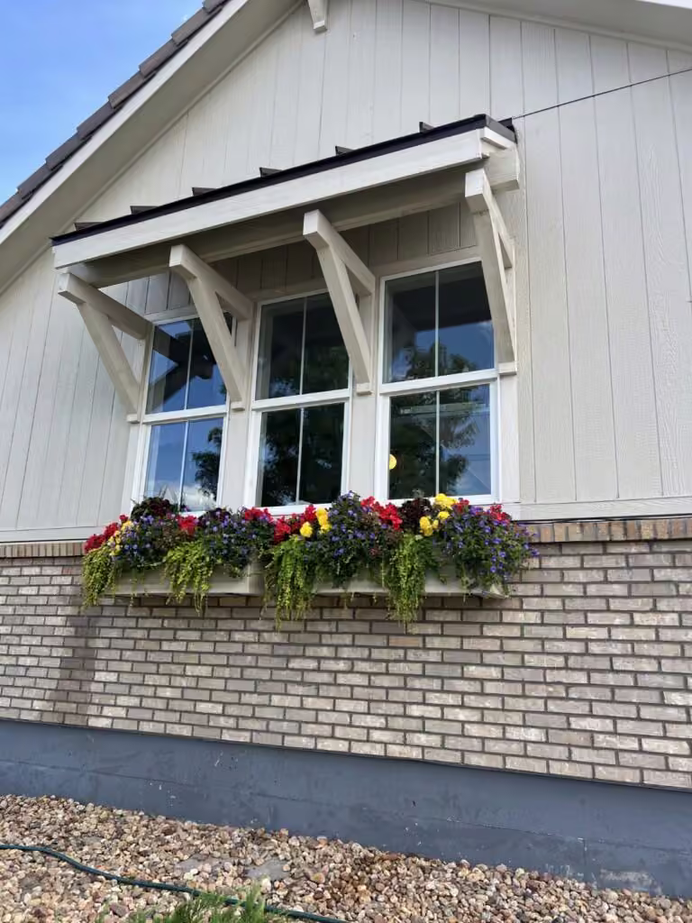 Clean residential windows and flower boxes on a Pane Pros Window Cleaning customer's home